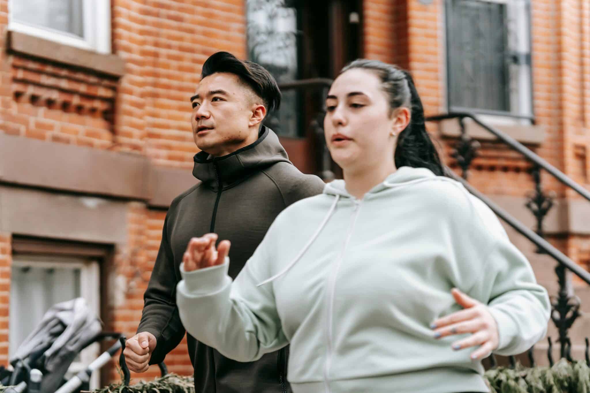 Man and woman walking for Workout Recovery.